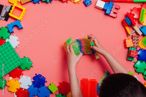 Children's developing game designer on a pink background