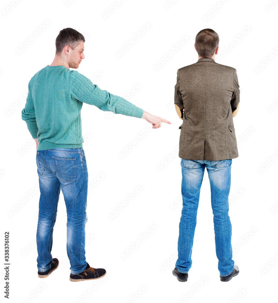 Back view of two man in sweater pointing. Back view of two man in sweater pointing.