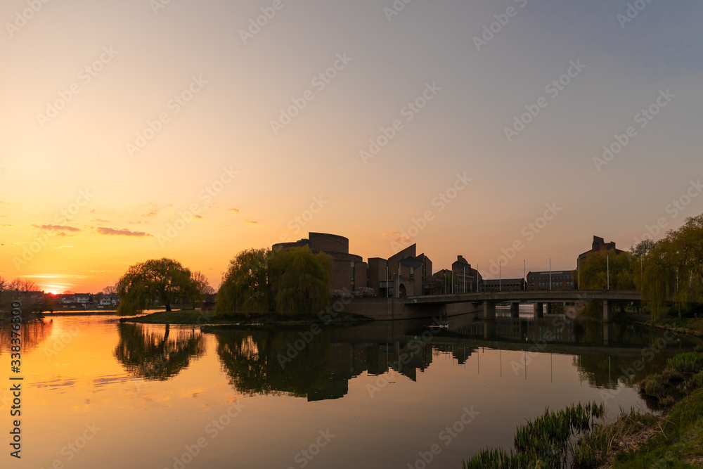 View on the river Meuse and Maastricht landscape with a view on St Pietersberh and Gouvernement building during sunset in april