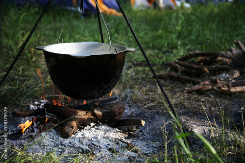 tourist cauldron over a campfire