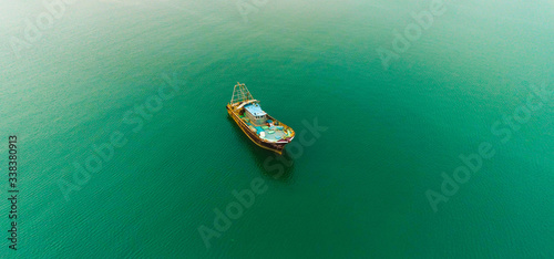 fisherman boat and Vintage wooden boat in sea. Boat drone photo