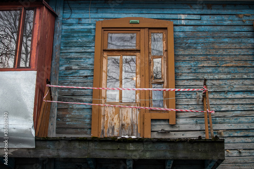 dilapidated housing  resettlement house on the background of a new house under construction