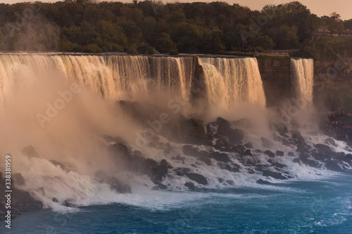 Panorama of the waterfall on the U.S. side at sunset. Concept of nature and travel. Niagara Falls  Canada. United States of America