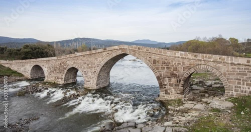 Assos, Canakkale, Turley. Old stone Hudavendigar bridge. Timelapse video in 4K. photo