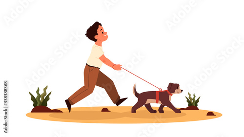 Child boy walking with a dog. Happy kid and pet spend time together.