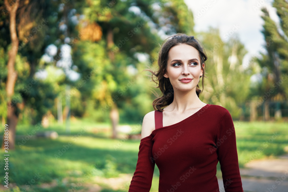 Portrait of young beautiful woman outdoors on green summer nature background Portrait of young beautiful woman outdoors on green summer nature background