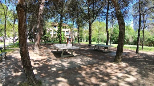 Walking Through Empty Park Shaded By Trees, Walking Past Ping Pong Tables on a Beautiful Spring Day in Toulouse, France