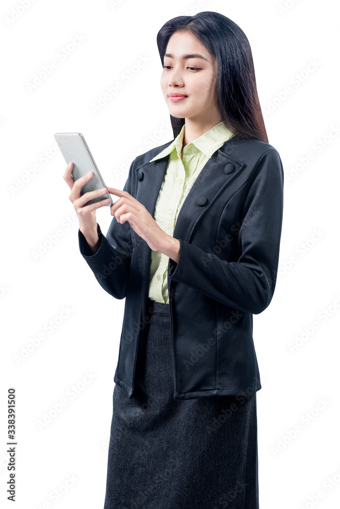 Asian businesswoman standing while using mobile phone Asian businesswoman standing while using mobile phone