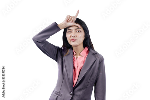 Cuadro en lienzo Asian businesswoman showing loser sign