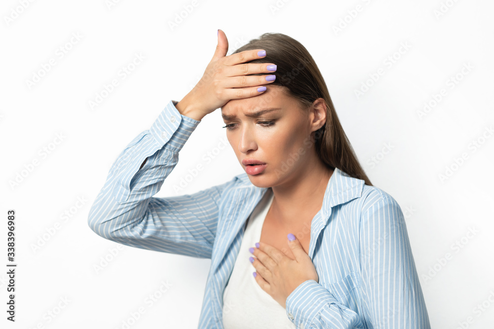 Woman Having Breathing Difficulty And Fever Standing On White Background