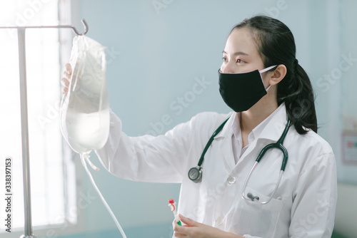 a female doctor showing how to dialysis