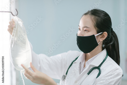 a female doctor showing how to dialysis