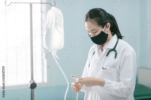 a female doctor showing how to dialysis