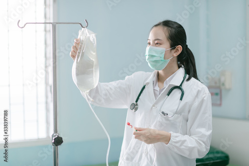 a female doctor showing how to dialysis