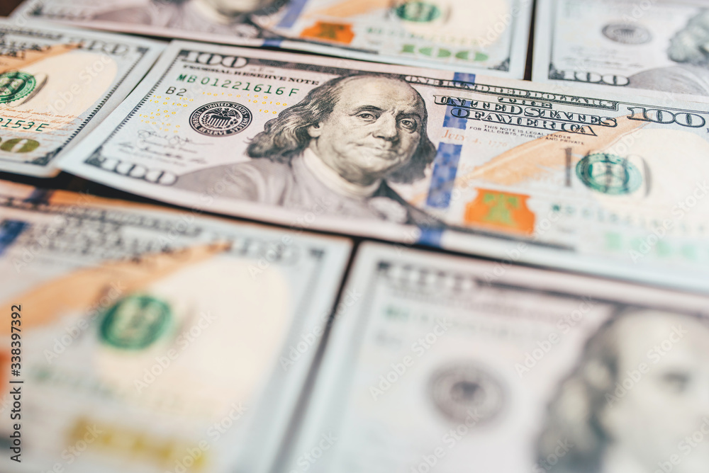 American cash dollars close-up. One Hundred Dollar Banknotes. Soft focus image. American cash dollars close-up. One Hundred Dollar Banknotes. Soft focus image.
