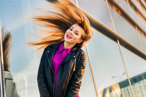 Pretty hipster girl throwing her hair and having fun