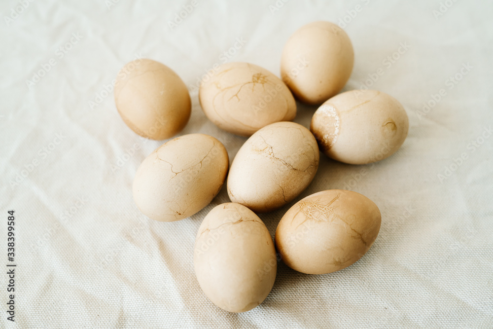 Seven Easter eggs trendy pastel colored with cracks lie on the table on a light tablecloth. top view. minimal style. easter concept.copy space for text Seven Easter eggs trendy pastel colored with cracks lie on the table on a light tablecloth. top view. minimal style. easter concept.copy space for text