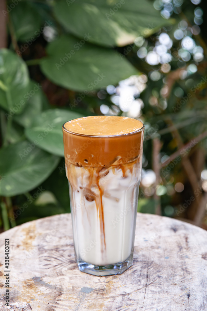 Iced Dalgona Coffee, a trendy fluffy creamy whipped coffee Iced Dalgona Coffee, a trendy fluffy creamy whipped coffee