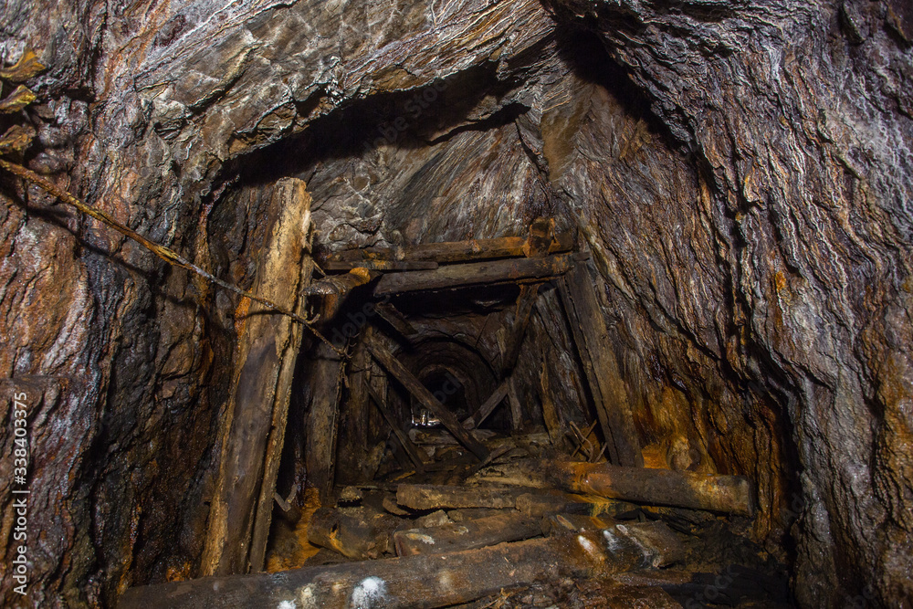 Underground bauxite mine tunnel with collapsed roof