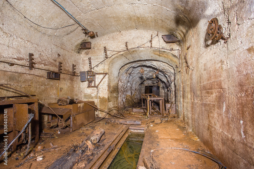 Underground abandoned bauxite ore mine tunnel with concrete lining