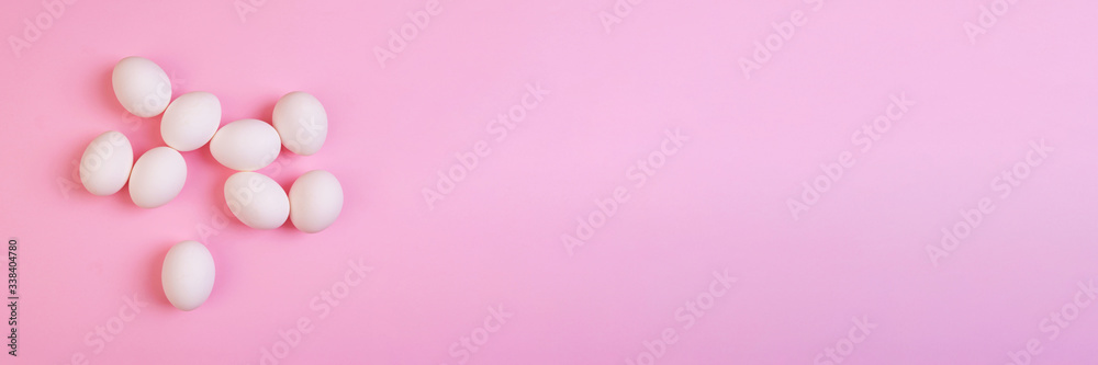 Beautiful banner with easter eggs. Food event concept. Bright festive decor. Colorful pink background. Flat design with copy space. Beautiful banner with easter eggs. Food event concept. Bright festive decor. Colorful pink background. Flat design with copy space.