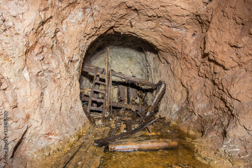 Underground bauxite mine tunnel with collapsed toilet shithouse
