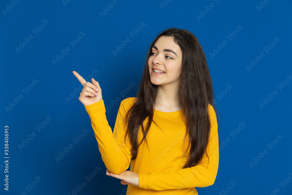 Brunette young girl wearing yellow jersey Brunette young girl wearing yellow jersey