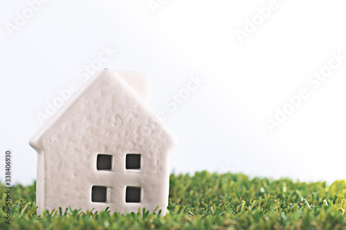 Little house on green grass with blue sky background,feel fresh and happy to living