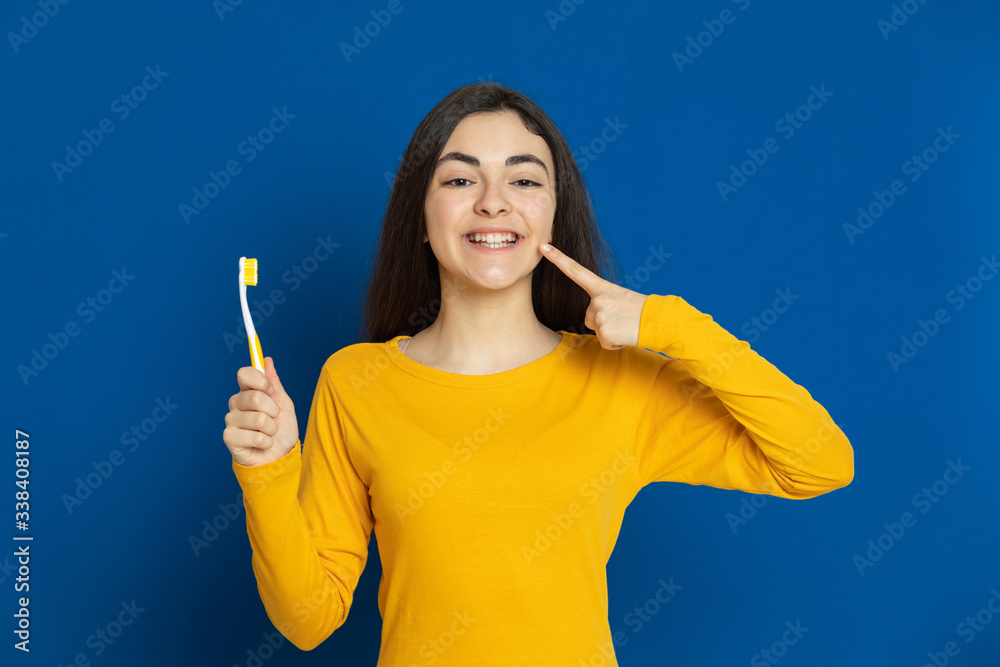 Brunette young girl wearing yellow jersey Brunette young girl wearing yellow jersey