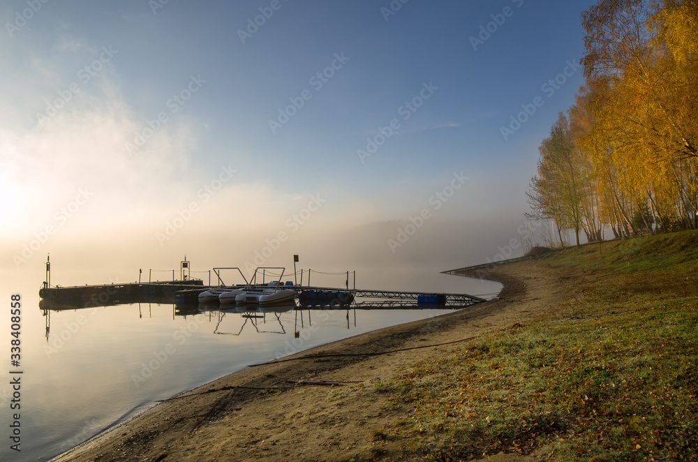 marina on the shore of the lake in autumn, Solina