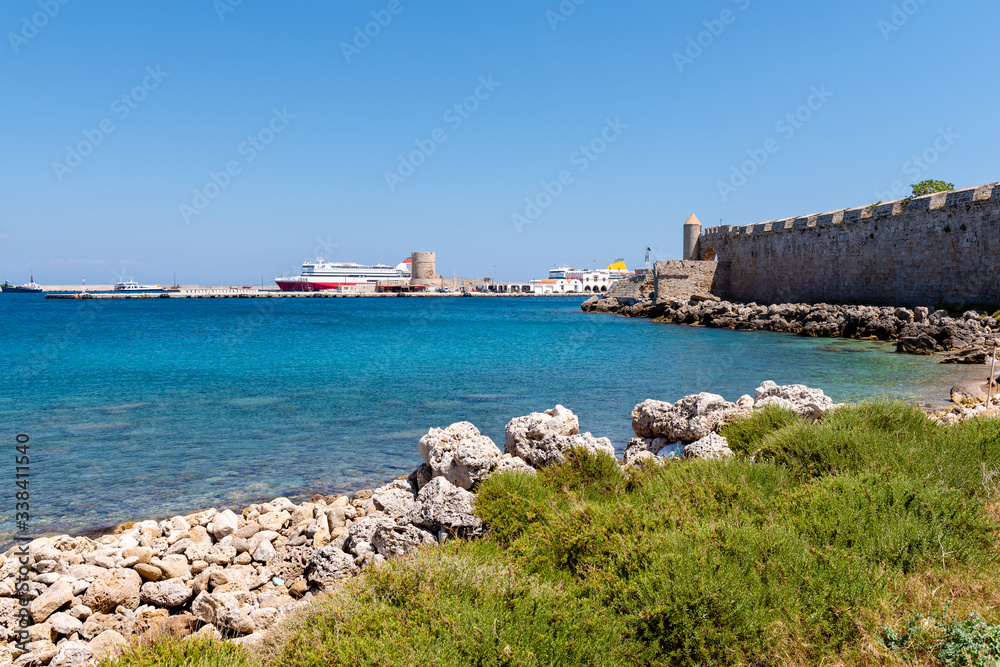 View of the bay and the port of Mandrakia in Rhodes. Greece