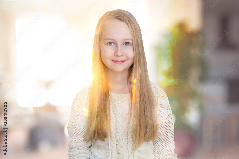 Little girl smiling portrait indoor against of sunset light
