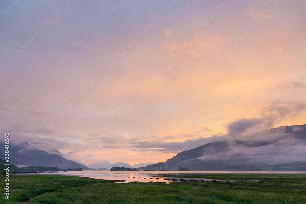 beautiful mystic sunset at glencoe and loch leven