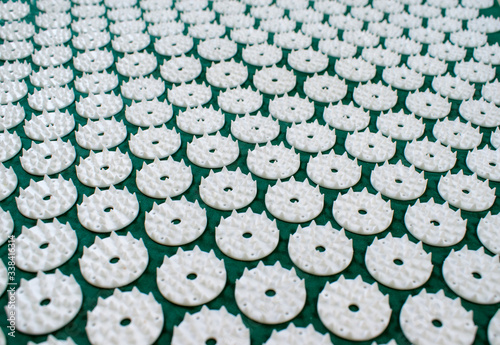 Acupressure mat for back and neck pain relief and muscle relaxation. Relieves stress, pain. photo