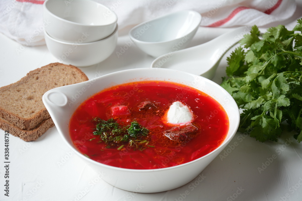 Traditional Ukrainian Russian borscht . Bowl of red beet root soup borsch with white cream . Beet Root delicious soup . Traditional Ukrain food cuisine Traditional Ukrainian Russian borscht . Bowl of red beet root soup borsch with white cream . Beet Root delicious soup . Traditional Ukrain food cuisine