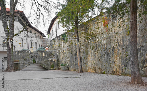 Christmas decorations in the street in the old historic hill village of Stanjel in the Komen municipality of Primorska, south west Slovenia. The village was fortified in the 17th century then badly da photo