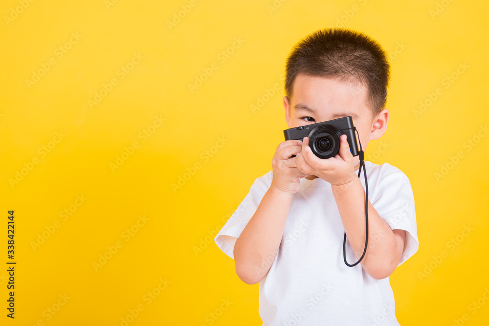 child boy hold photo camera compact doing taking the picture child boy hold photo camera compact doing taking the picture