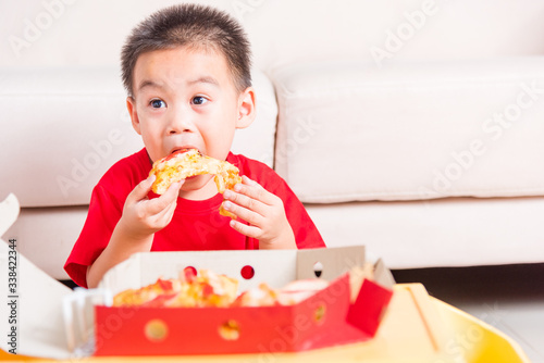 Little Child enjoying eating Delivery