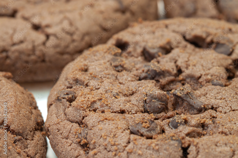 Chocolate cookies with choco crisps and white background Chocolate cookies with choco crisps and white background