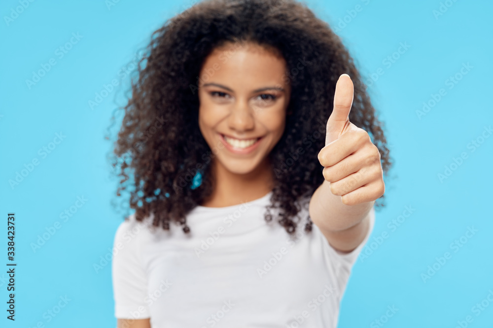 young woman showing thumbs up young woman showing thumbs up