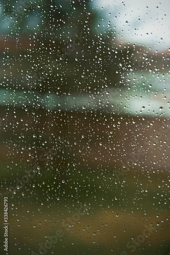 An image in a window with raindrops