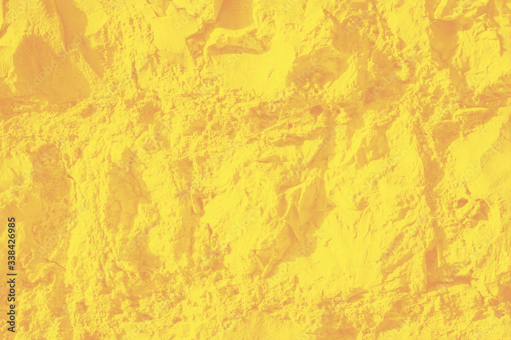 Wall sandstone texture background. Yellow surface, stone vintage texture. Voluminous background, toned