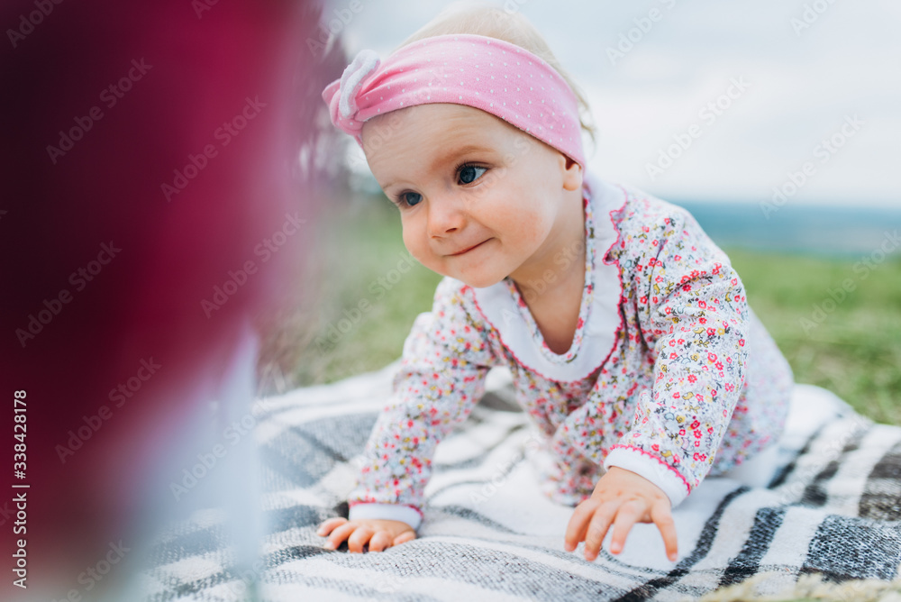 Baby playing in nature. Little girl at picnic. Baby playing in nature. Little girl at picnic.