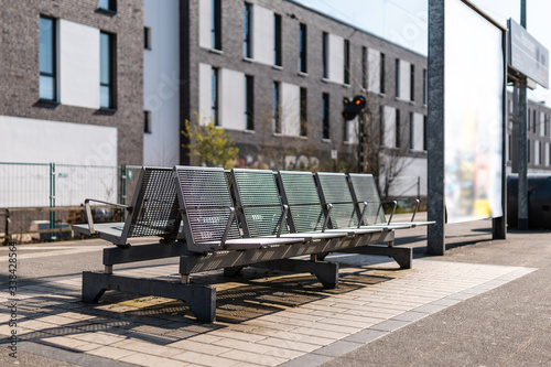 Deserted sunny trainstation, empty seats, in Rahlstedt