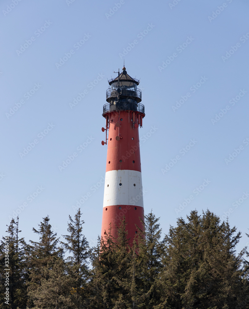 red white lighthouse in morning sun