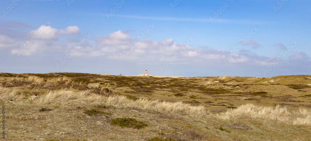 dunes with small lighthouse dunes with small lighthouse
