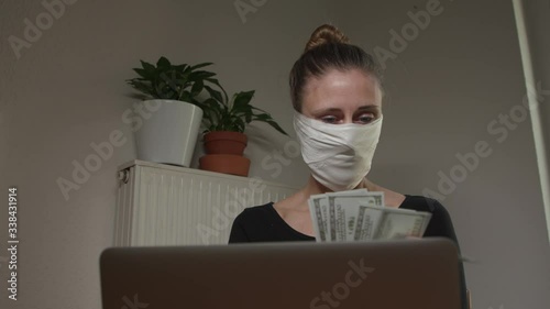 Woman counting money bills during corona time.