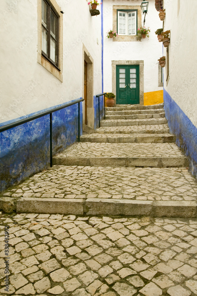 Narrow village streets of Obidos founded by the Celts in 300 BC, Portugal