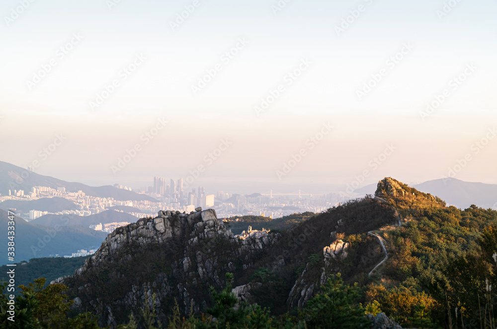 Natural autumn scenery from the top of Geumjeongsan mountain in Busan, Korea and urban landscape in Haeundae area