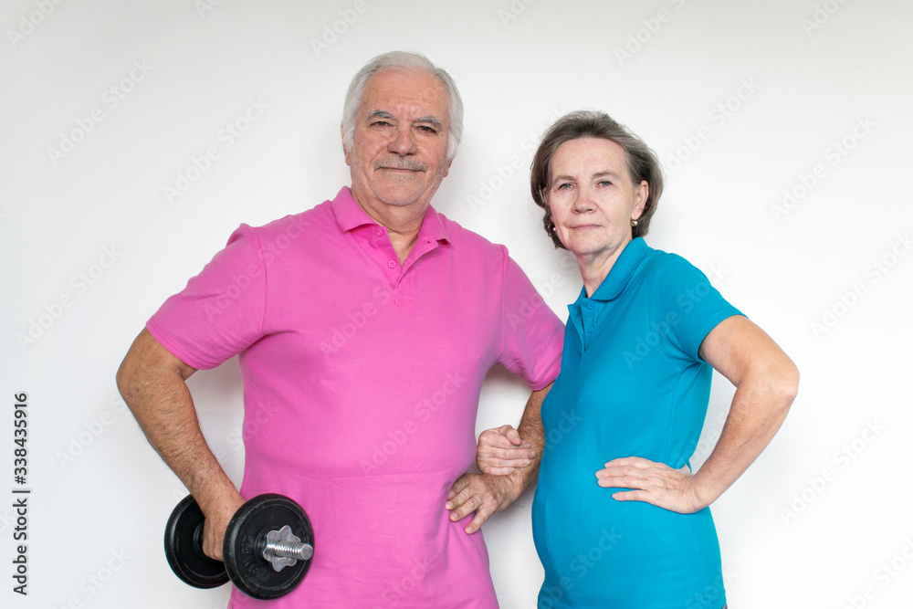 healthy white fit smiling happy senior male female couple stand posing, life is good healthy white fit smiling happy senior male female couple stand posing, life is good